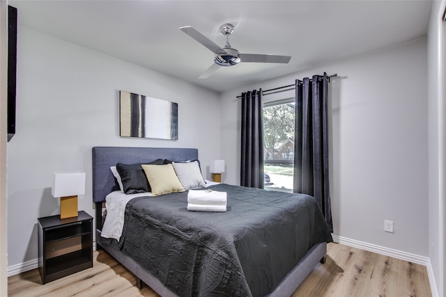 bedroom featuring ceiling fan and light hardwood / wood-style flooring