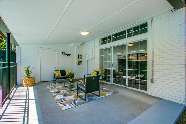 view of patio / terrace with a balcony and an outdoor hangout area