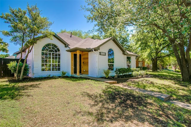 ranch-style house with a front yard