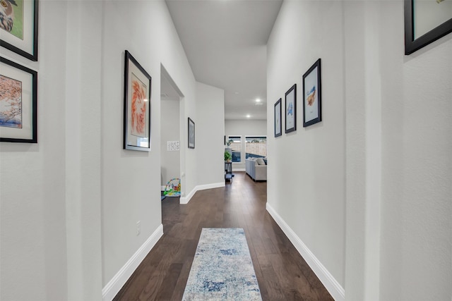 corridor featuring dark hardwood / wood-style floors