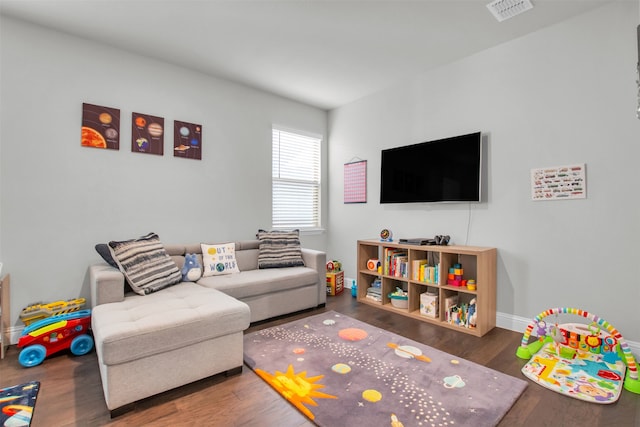 game room with dark hardwood / wood-style flooring