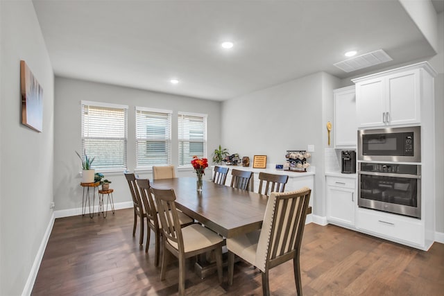 dining space featuring dark hardwood / wood-style flooring