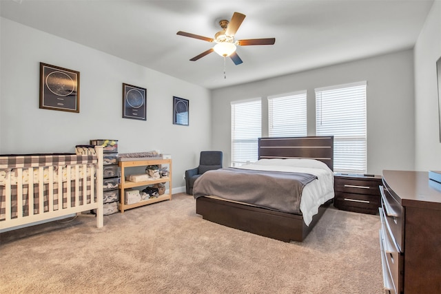 carpeted bedroom featuring ceiling fan