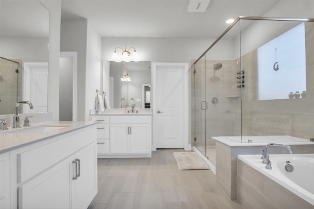 bathroom featuring separate shower and tub and vanity