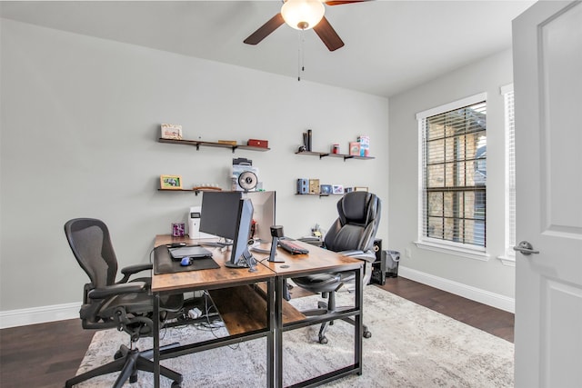 office area with ceiling fan and dark hardwood / wood-style flooring