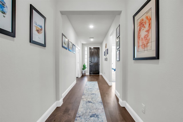 hallway featuring dark wood-type flooring