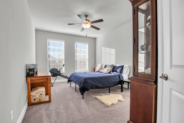 bedroom with ceiling fan and carpet