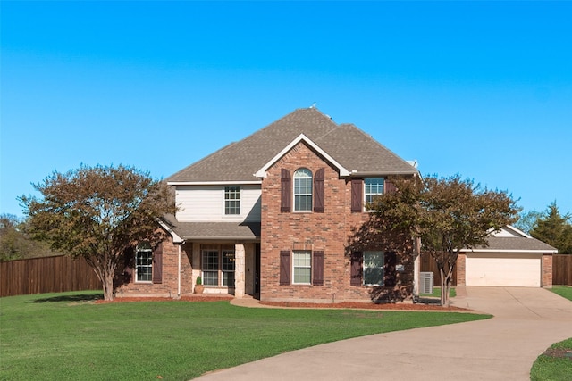 view of front of home featuring a front yard and a garage