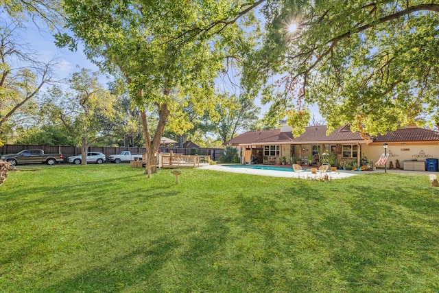 view of yard featuring a fenced in pool and a patio area