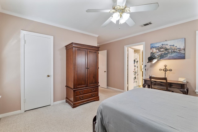 bedroom featuring light carpet, ensuite bathroom, ceiling fan, and ornamental molding