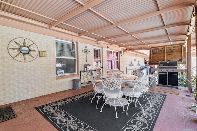 dining space with brick wall