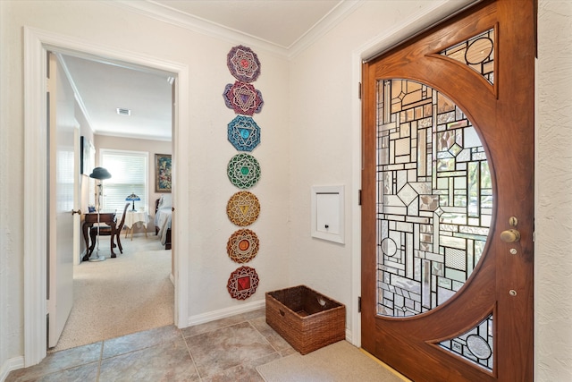 entrance foyer featuring light colored carpet and crown molding