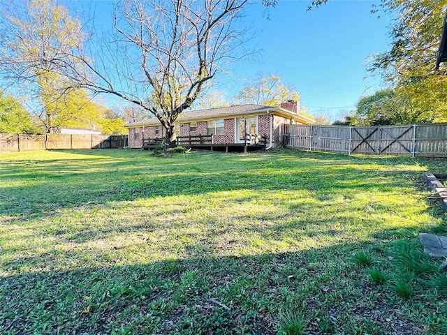 view of yard with a deck