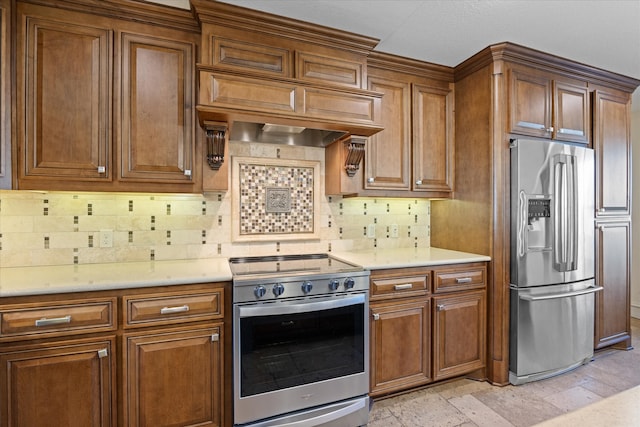 kitchen with custom range hood, backsplash, and appliances with stainless steel finishes