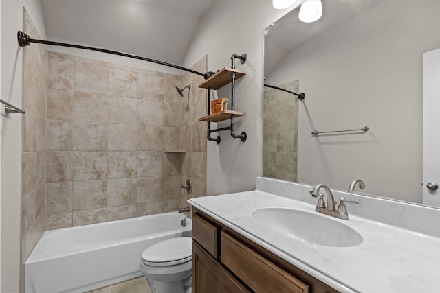 full bathroom with vanity, tiled shower / bath combo, toilet, and vaulted ceiling