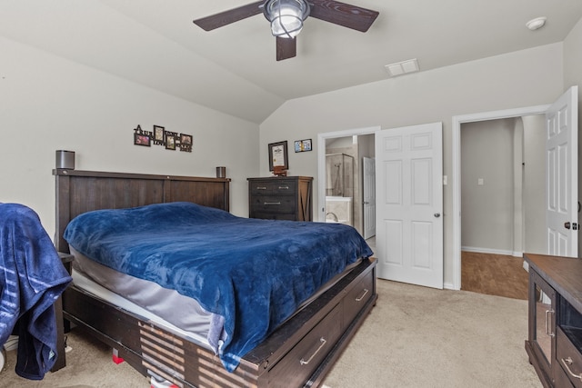 carpeted bedroom featuring ensuite bath, ceiling fan, and lofted ceiling