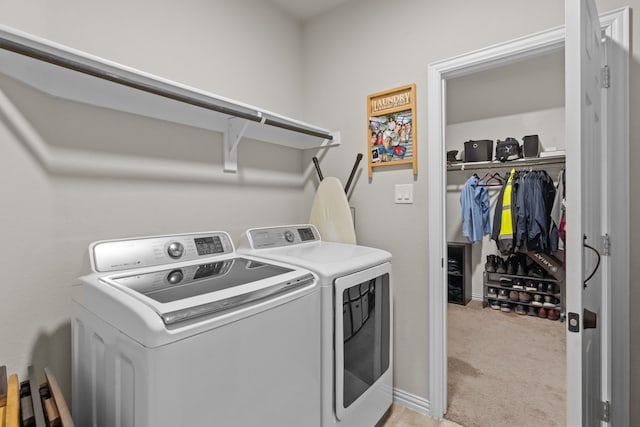 laundry room with light carpet and washer and clothes dryer