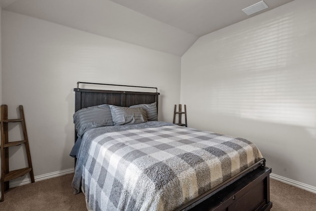 bedroom with carpet and lofted ceiling