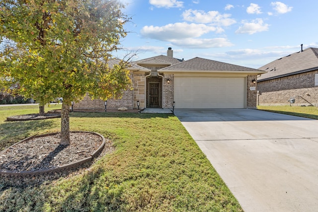 view of front of house with a garage and a front lawn