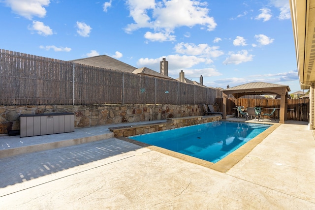 view of swimming pool featuring a gazebo and a patio