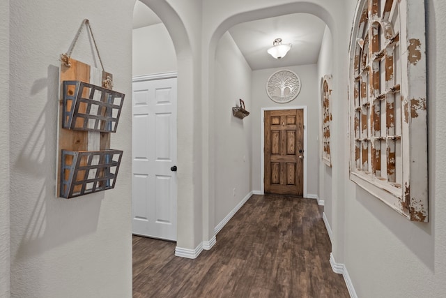 hall with dark wood-type flooring