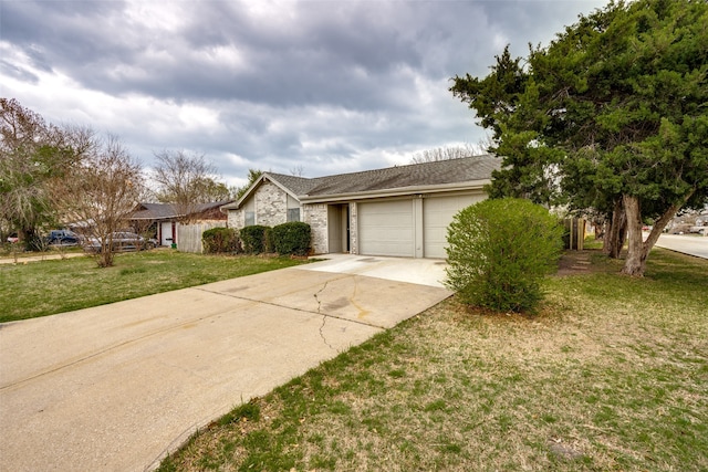 single story home with a front yard and a garage