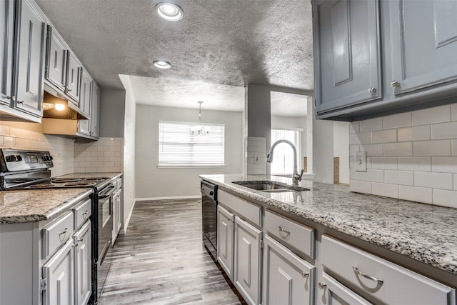 kitchen with gray cabinets, stainless steel electric range oven, sink, and dishwasher