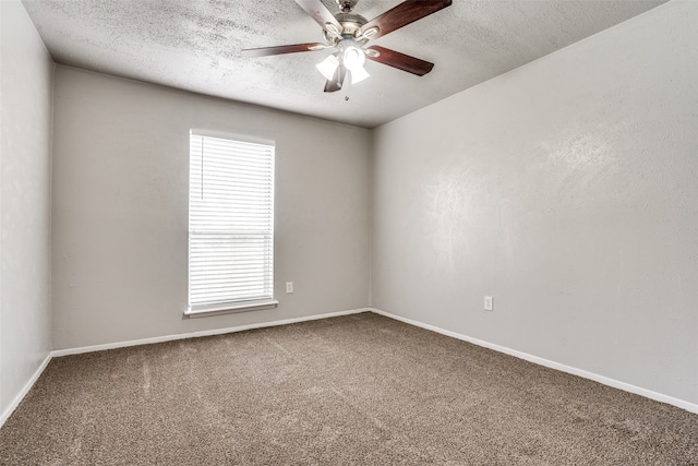 unfurnished room featuring a textured ceiling, carpet floors, and a wealth of natural light