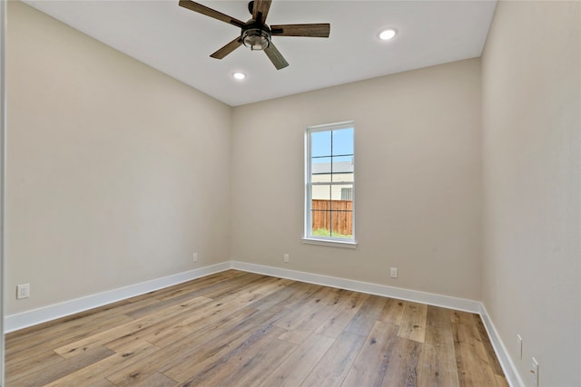 unfurnished room featuring ceiling fan and light wood-type flooring