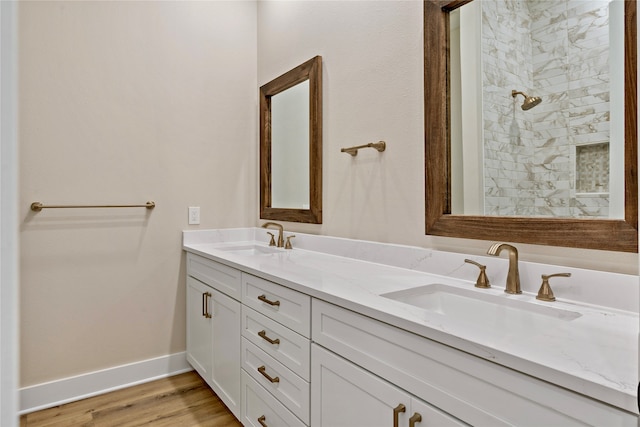 bathroom featuring hardwood / wood-style flooring and vanity