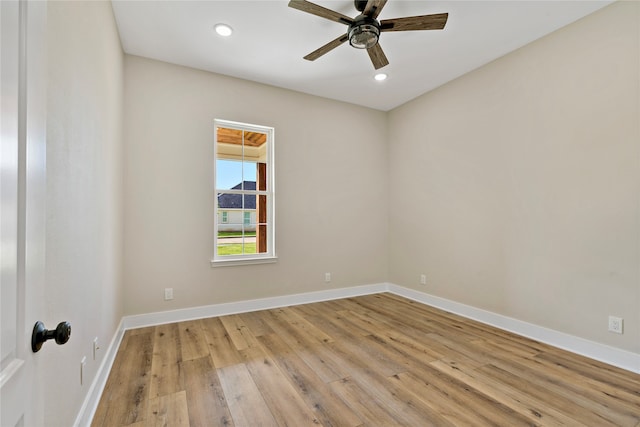 unfurnished room with ceiling fan and light hardwood / wood-style flooring