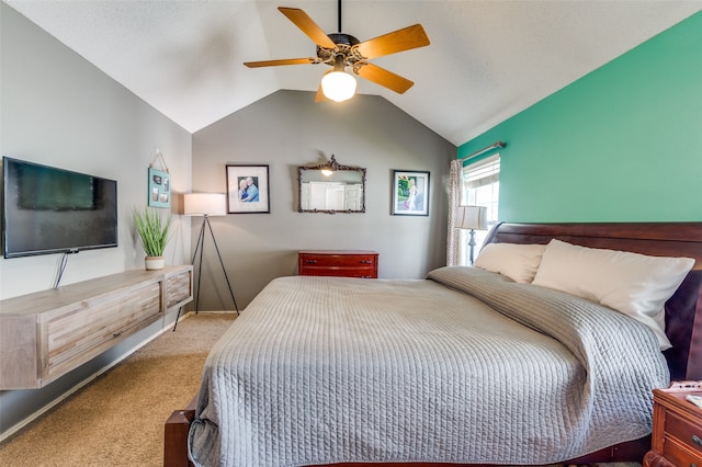 carpeted bedroom featuring ceiling fan and lofted ceiling