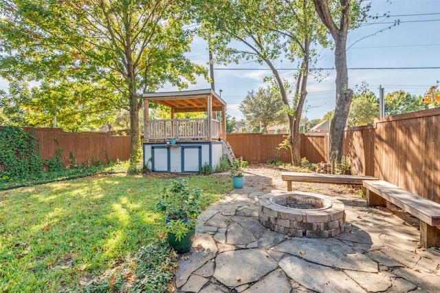 view of patio / terrace featuring a fire pit and a swimming pool