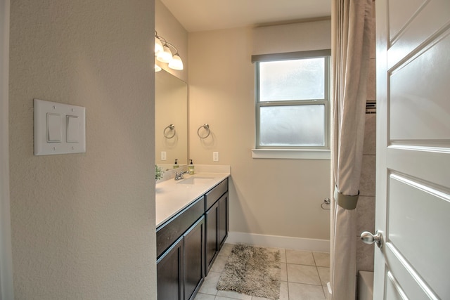 bathroom with tile patterned flooring and vanity