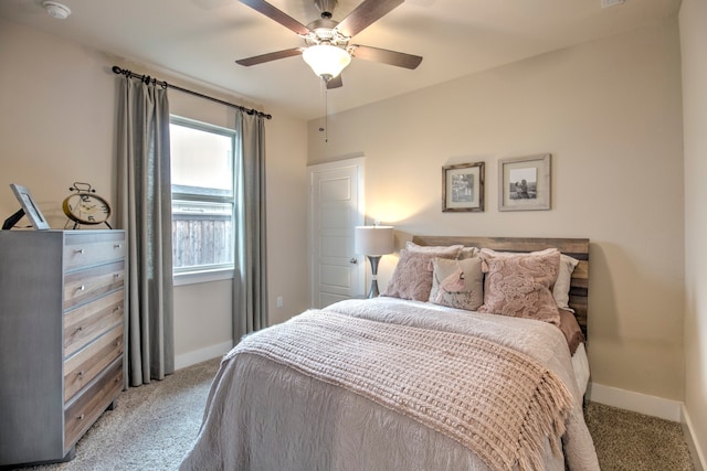 carpeted bedroom featuring ceiling fan