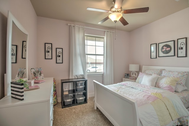 bedroom featuring ceiling fan and light colored carpet