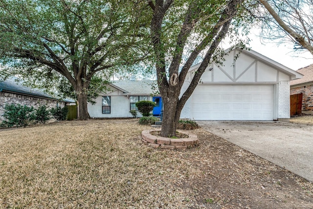 view of front facade with a garage and a front yard