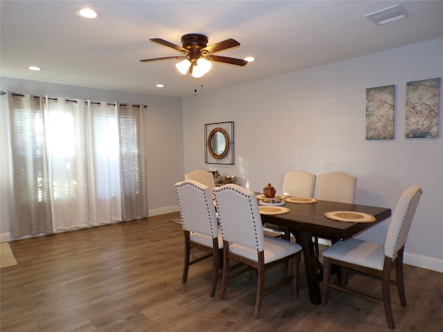 dining room featuring dark hardwood / wood-style floors and ceiling fan