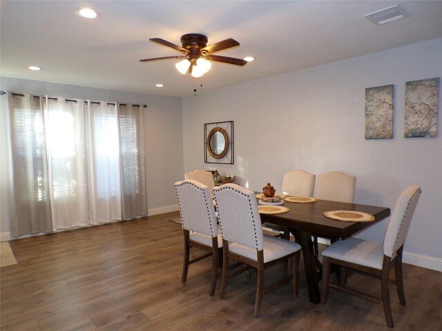 dining room featuring dark hardwood / wood-style floors and ceiling fan