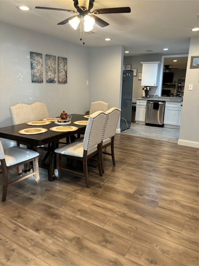 dining room featuring ceiling fan and hardwood / wood-style flooring