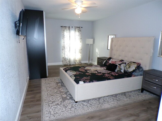 bedroom featuring ceiling fan and hardwood / wood-style floors