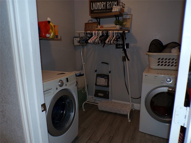 laundry area with dark hardwood / wood-style flooring