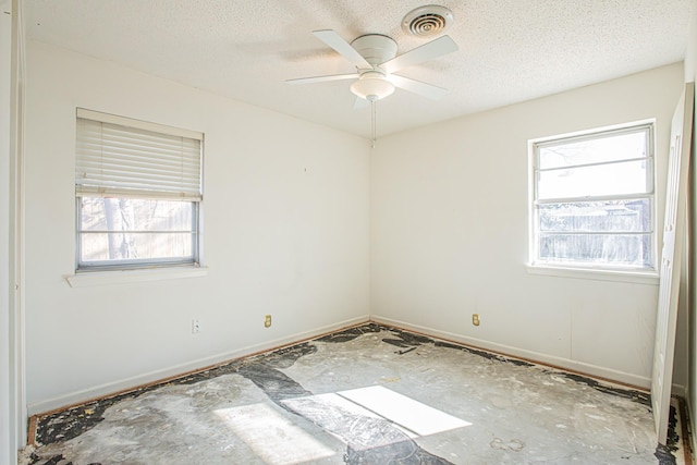 unfurnished room featuring a textured ceiling and ceiling fan