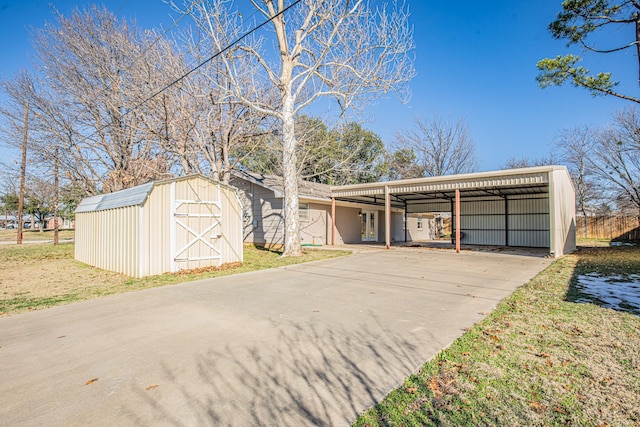 view of front of home featuring a storage unit