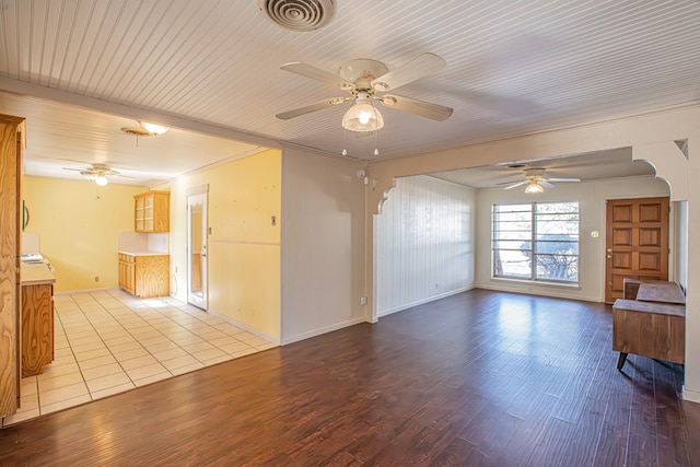 unfurnished living room with ceiling fan and light hardwood / wood-style flooring