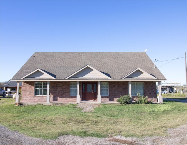 332 NW County Road 2005, Corsicana, TX 75110 - ranch-style house with brick siding, a front yard, and a shingled roof