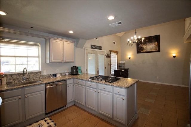 332 NW County Road 2005, Corsicana, TX 75110 - kitchen featuring stainless steel appliances, a sink, a peninsula, a chandelier, and recessed lighting