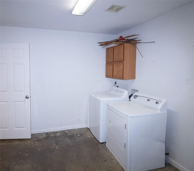 332 NW County Road 2005, Corsicana, TX 75110 - washroom featuring washer and clothes dryer, cabinet space, and baseboards