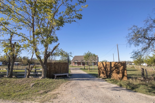 332 NW County Road 2005, Corsicana, TX 75110 - view of dirt / gravel driveway with a gated entry