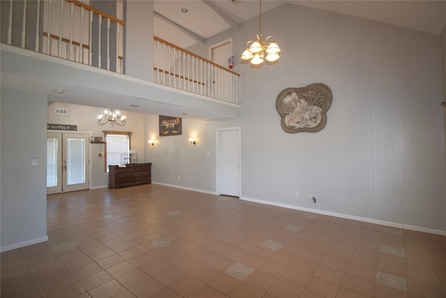 332 NW County Road 2005, Corsicana, TX 75110 - unfurnished living room featuring a chandelier, high vaulted ceiling, tile patterned floors, and baseboards